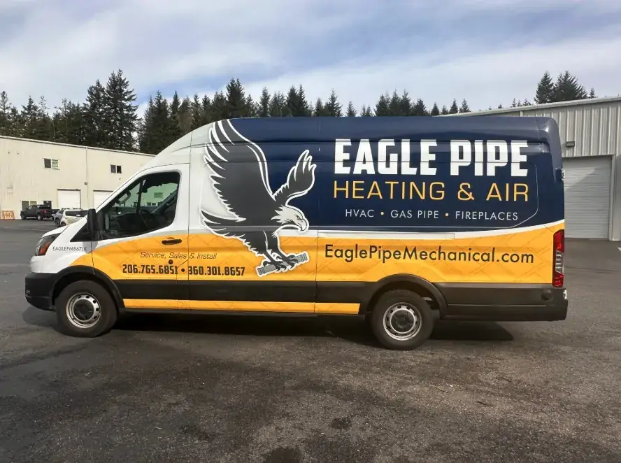 Eagle Pipe white service van parked at a Kitsap Peninsula job site